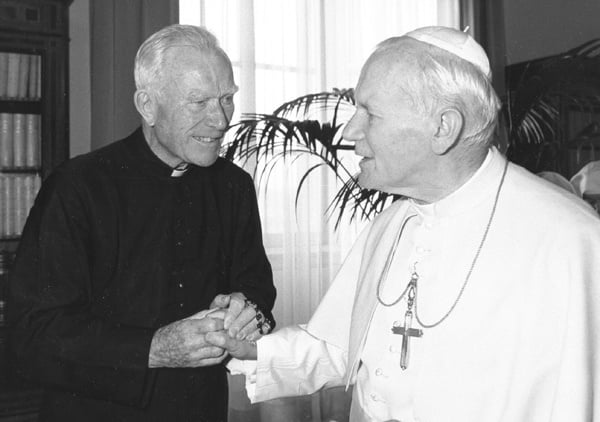 Father Peyton, left, with Rosary in hand, greeting Pope John Paul II in 1980.